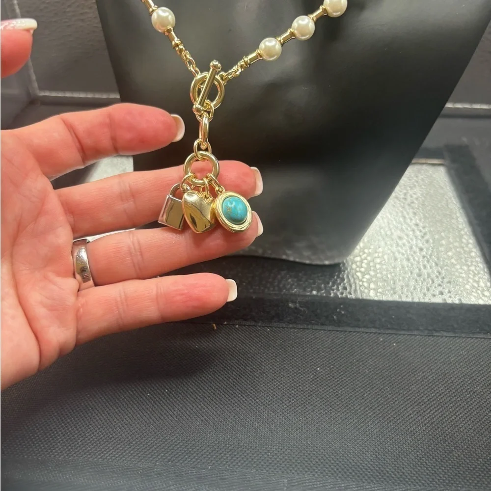 Elegant Pearl and Gold Necklace with Turquoise charm, a heart and a lock.